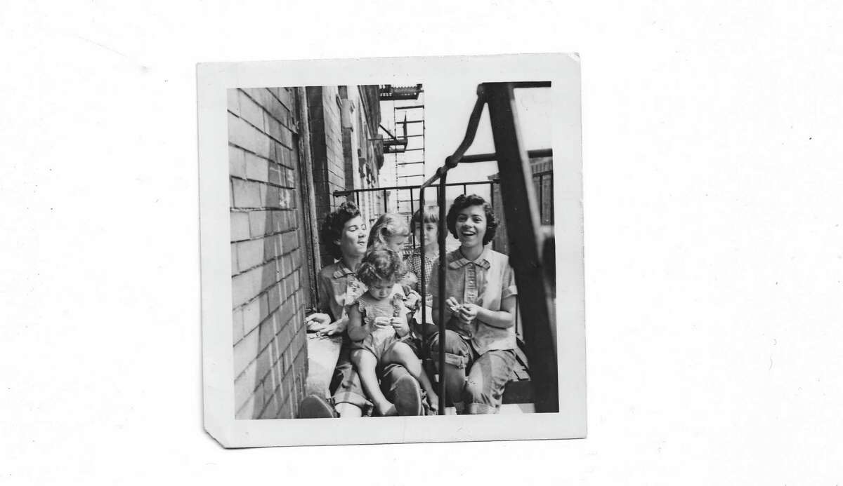 For Juan Negroni, this photo from an old friend with her sisters on the fire escape of their Spanish Harlem tenement surfaced memories.