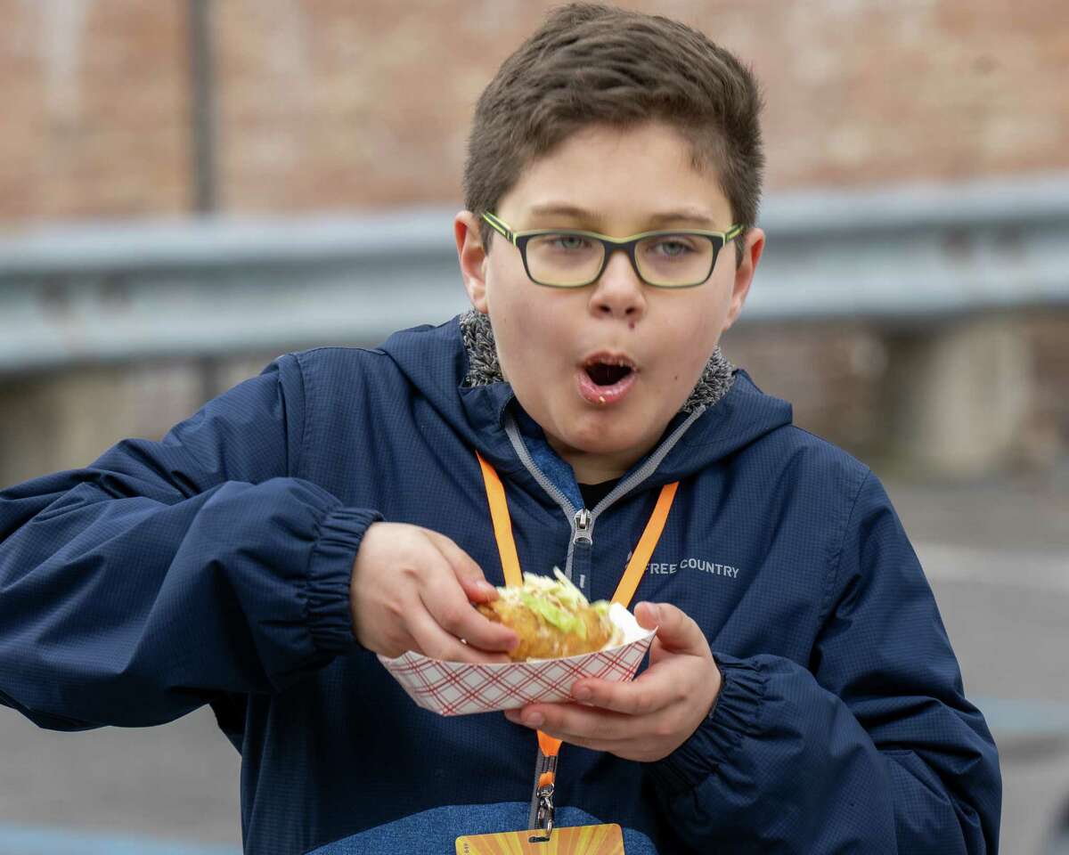 Max Abdul shows appreciation for a mac-n-cheese eggroll at the Mac-n-Cheese Bowl, that returned after a two-year hiatus on Saturday, March 26, 2022. It was held outside for the first time on Remsen Street in Cohoes and proceeds benefit the Regional Foodbank of Northeastern New York. (Jim Franco/Special to the Times Union)