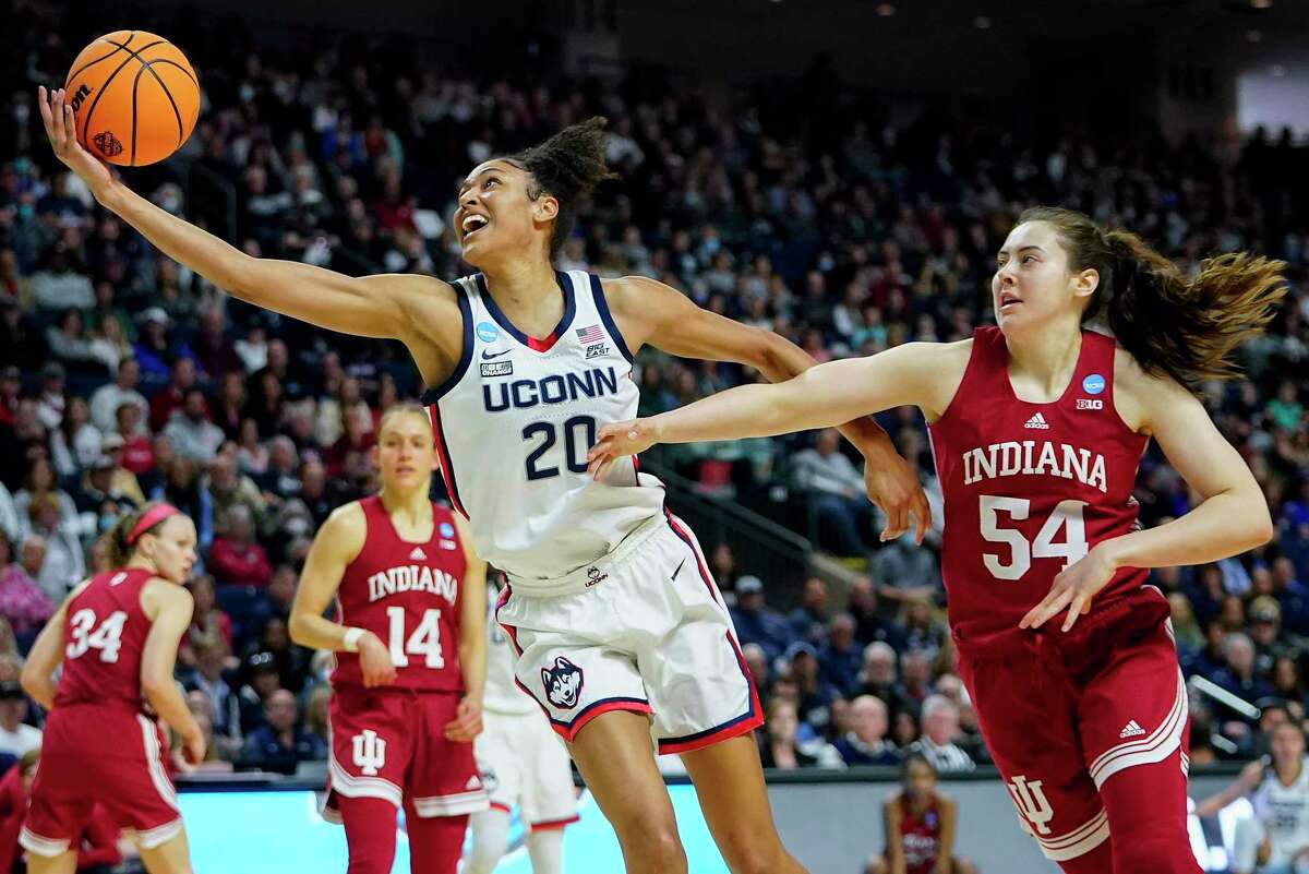 UConn’s Olivia Nelson-Ododa (20) reaches for a rebound against Indiana during the second quarter Saturday in Bridgeport.
