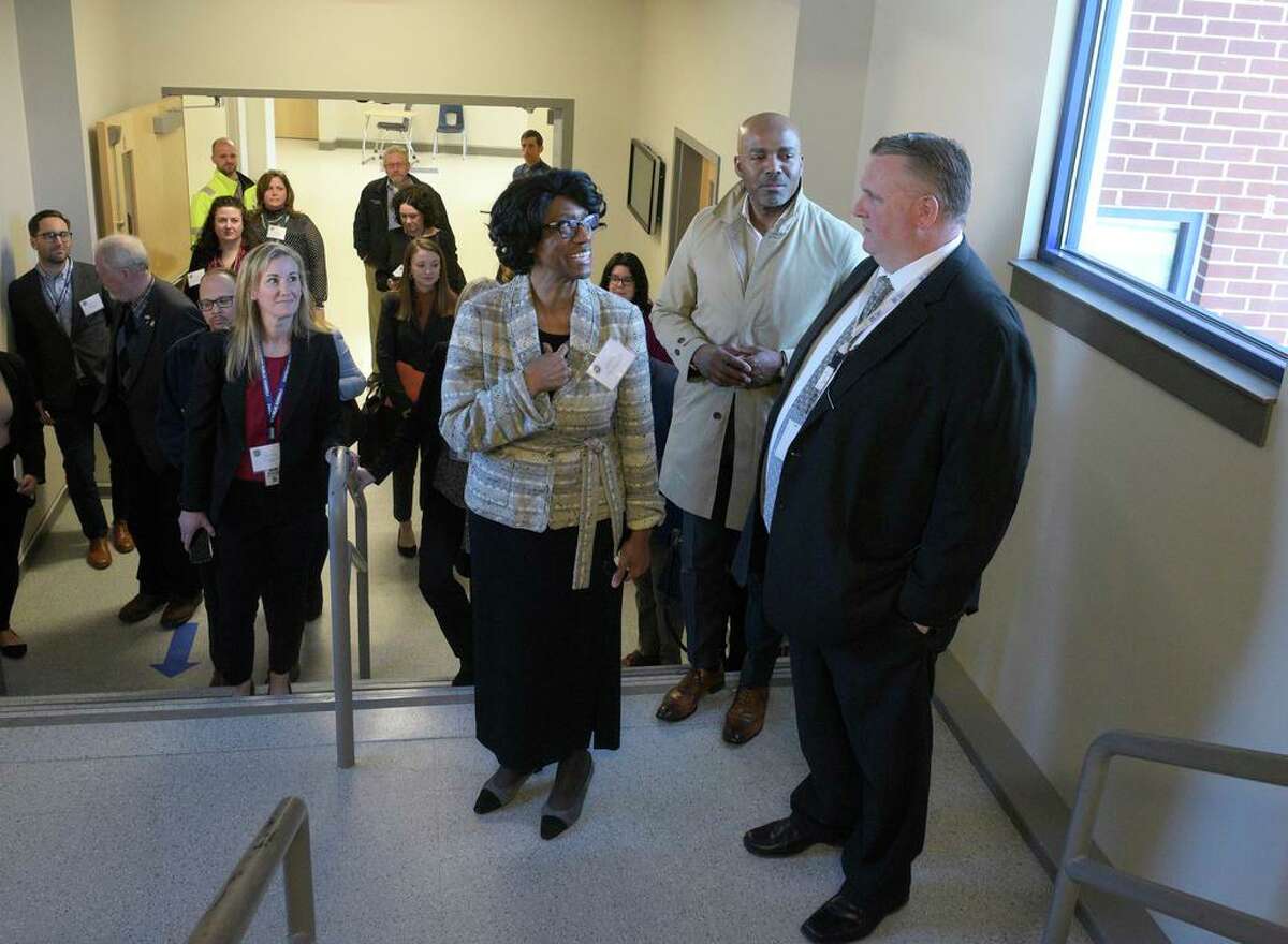 Connecticut Education Commissioner Charlene Russel-Tucker speaks with Danbury High School Principal Dan Donovan, right, and Superintendent Kevin Walston during a tour of the high school by Russel-Tucker. Tuesday morning. March 22, 2022, Danbury, Conn.