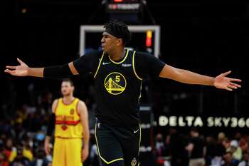 ATLANTA, GA - MARCH 25: Kevon Looney #5 of the Golden State Warriors reacts during the second half against the Atlanta Hawks at State Farm Arena on March 25, 2022 in Atlanta, Georgia. NOTE TO USER: User expressly acknowledges and agrees that, by downloading and or using this photograph, User is consenting to the terms and conditions of the Getty Images License Agreement. (Photo by Todd Kirkland/Getty Images)