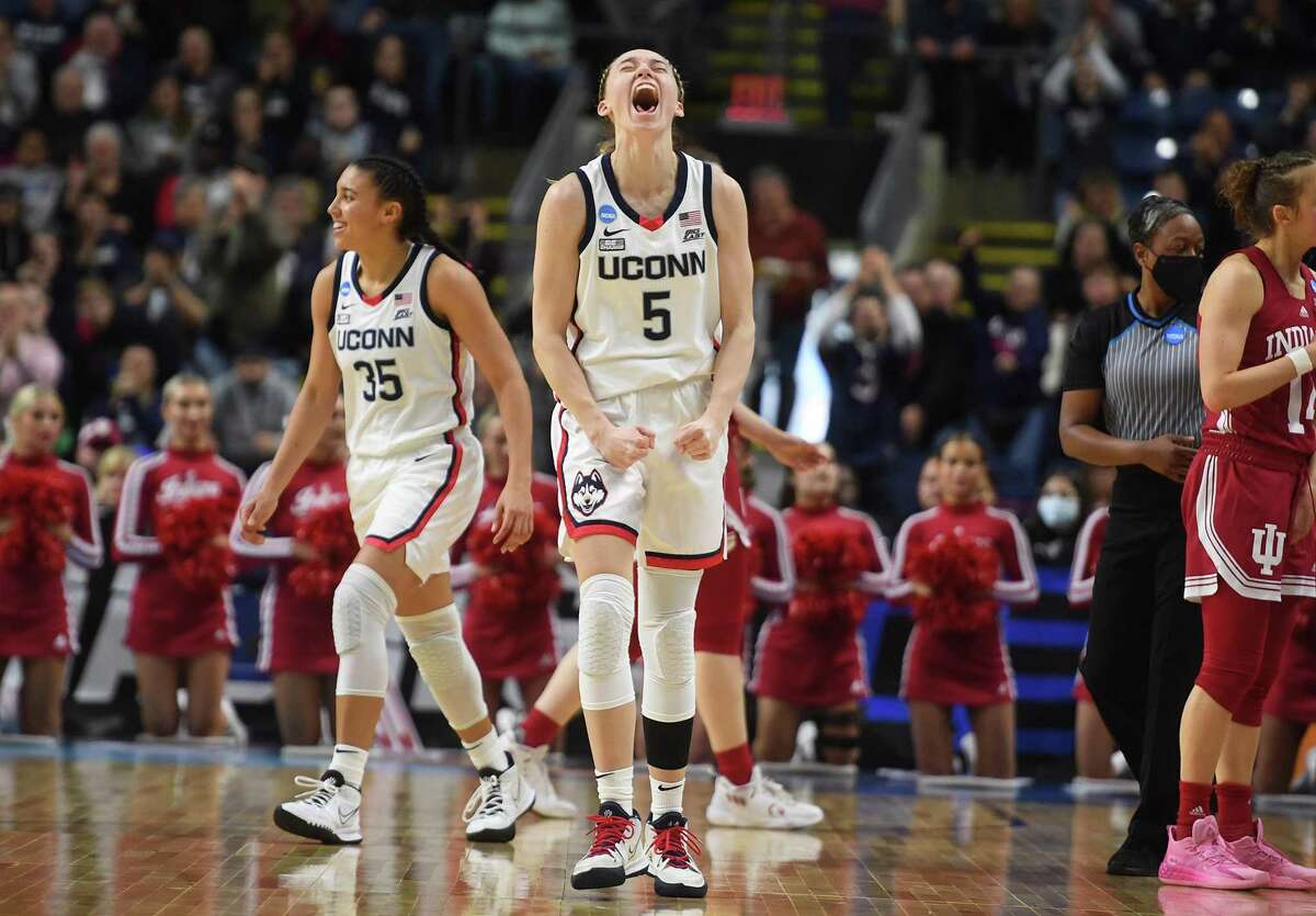 UCONN's Paige Bueckers celebrates during her team's 75-58 defeat of Indiana in their Sweet Sixteen NCAA basketball tournament game at the Total Mortgage Arena in Bridgeport, Conn., on Saturday, March 26, 2022.