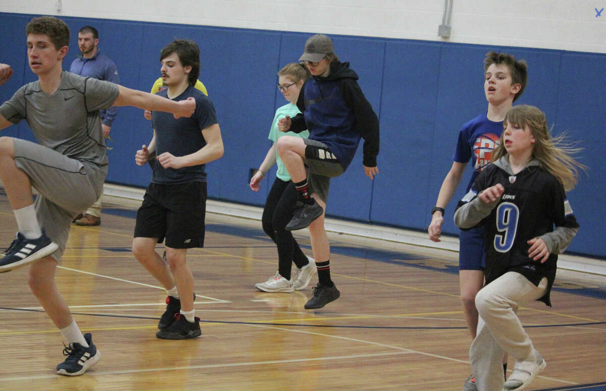 Morley Stanwood's track team goes through workouts last week in the elementary school gym.