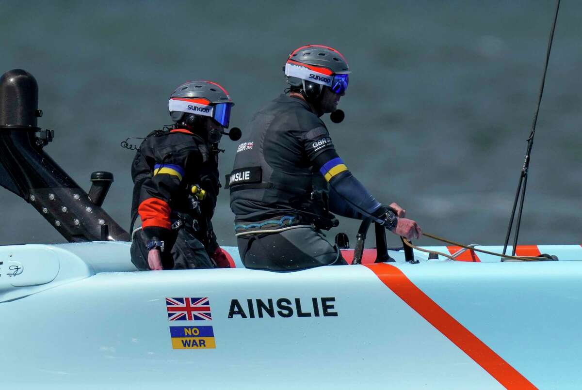 Britain’s SailGP Team, helmed by Ben Ainslie, with a “No War” Ukrainian flag solidarity sticker underneath the Union Flag, competes Saturday in San Francisco Bay.