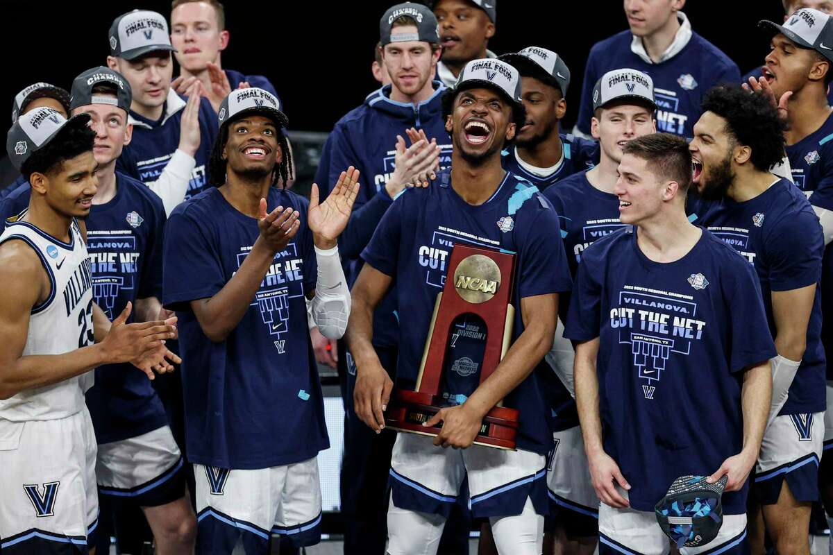 The Villanova Wildcats celebrate their victory over the Houston Cougars after the NCAA South Regional men’s basketball final at AT&T Center, Saturday, March 26, 2022, in San Antonio, Texas. The Wildcats defeated the Cougars 50-44 in the Elite 8 to advance to the Final Four in New Orleans.