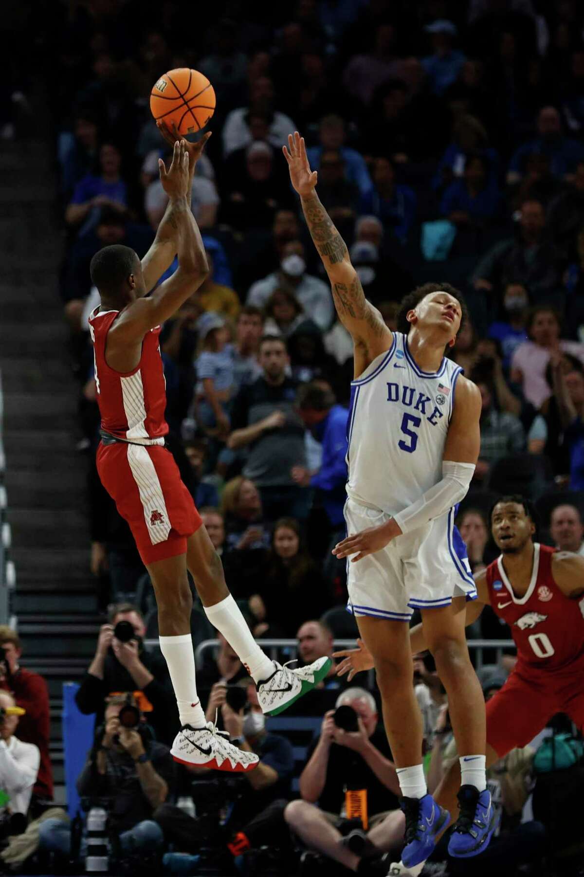 Arkansas guard Davonte Davis shoots a jumper as Duke forward Paolo Banchero defends during the first half of a college basketball game in the Elite 8 round game of the 2022 NCAA Men's Basketball Tournament at Chase Center in San Francisco, Saturday, March 26, 2022.