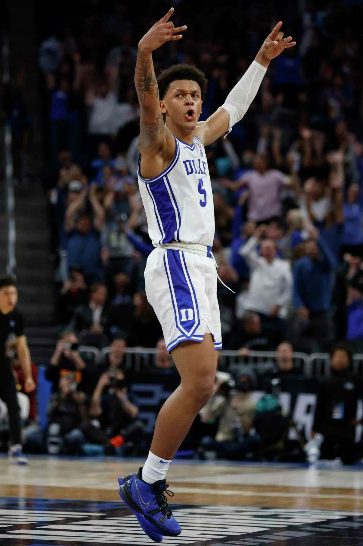 Duke forward Paolo Banchero reacts after teammate guard Trevor Keels shoots a buzzer-beating three-pointer during the first half of a college basketball game against Arkansas in the Elite 8 round game of the 2022 NCAA Men's Basketball Tournament at Chase Center in San Francisco, Saturday, March 26, 2022.