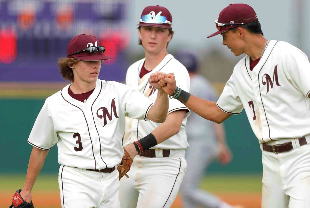 Magnolia relief pitcher Aiden Leggett (3) gets a high-five from Blake Casey (7) in the fifth inning of a high school baseball game during the Brenham/Montgomery Tournament, Friday, March 4, 2022, in Montgomery.