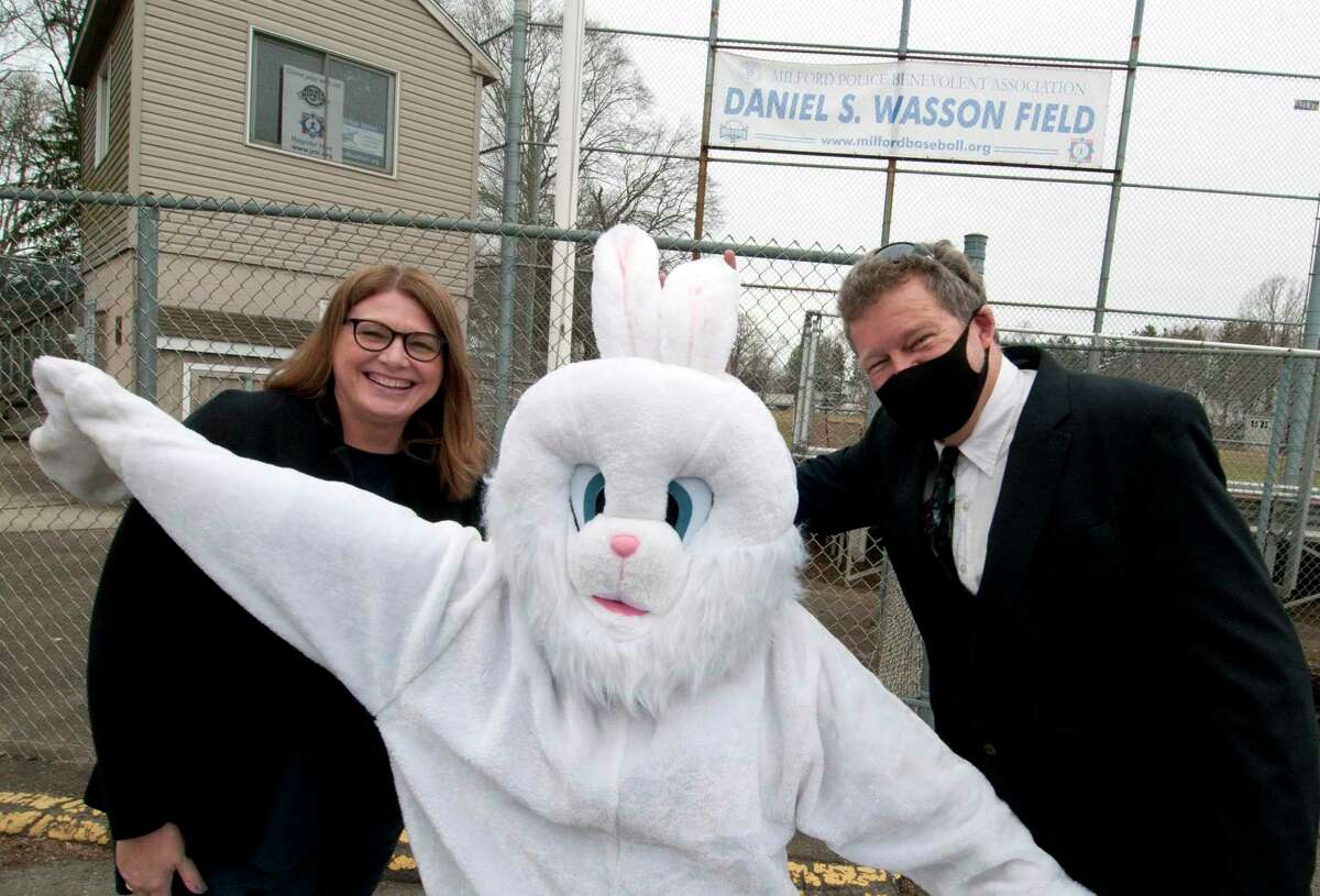 The second annual Easter Eggstravaganza is moving from Wasson Field to the Milford Green in downtown Milford. The event takes places on Saturday, April 9 from 10 a.m. to 3 p.m. Pictured with the Easter Bunny is Tracy Bonosconi, President of the Downtown Milford Business Alliance, left, and Radio Personality and DMBA board member Brian Smith at Wasson Field in Milford, Conn., on Wednesday March 24, 2021.