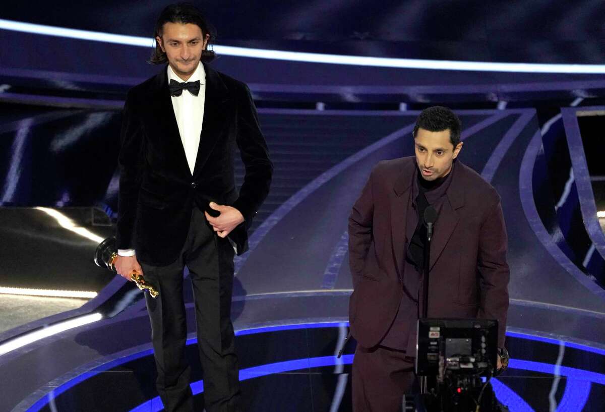 Aneil Karia, left, and Riz Ahmed accept the award for best live action short for "The Long Goodbye" at the Oscars on Sunday, March 27, 2022, at the Dolby Theatre in Los Angeles.