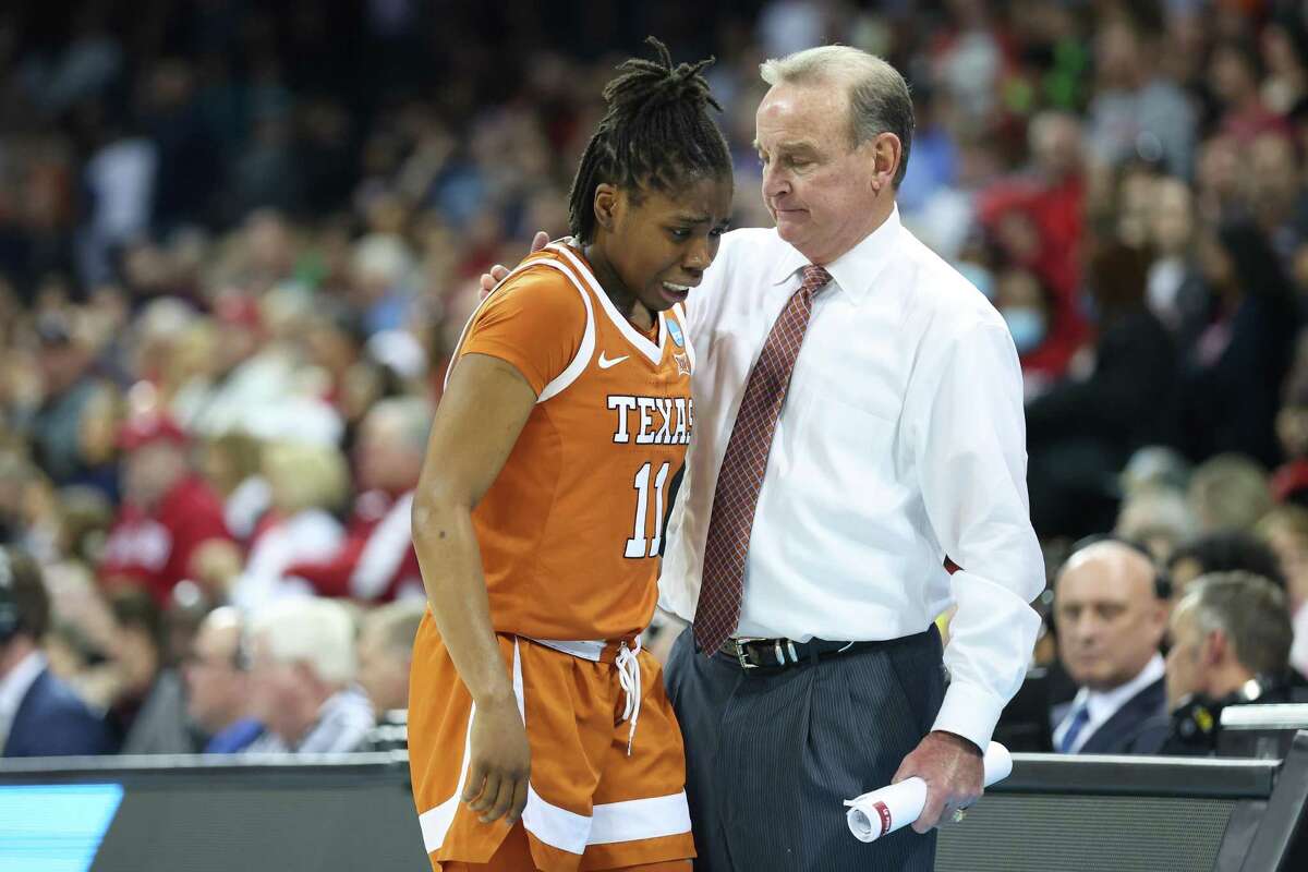 SPOKANE, WASHINGTON - MARCH 27: Head coach Vic Schaefer of the Texas Longhorns consoles Joanne Allen-Taylor #11 after she fouls out during the fourth quarter against the Stanford Cardinal in the NCAA Women's Basketball Tournament Elite 8 Round at Spokane Veterans Memorial Arena on March 27, 2022 in Spokane, Washington. (Photo by Abbie Parr/Getty Images)