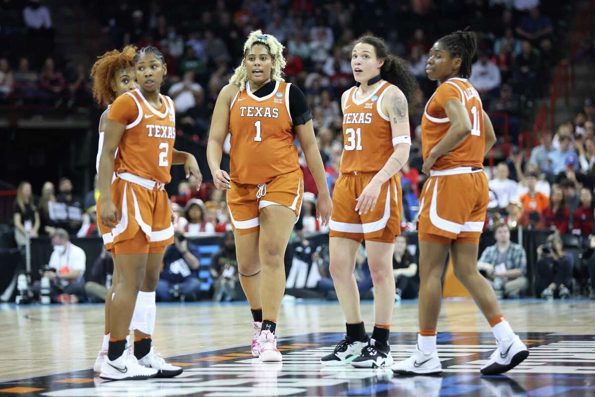 SPOKANE, WASHINGTON - MARCH 27: The Texas Longhorns players gather on court during the fourth quarter against the Stanford Cardinal in the NCAA Women's Basketball Tournament Elite 8 Round at Spokane Veterans Memorial Arena on March 27, 2022 in Spokane, Washington. (Photo by Abbie Parr/Getty Images)