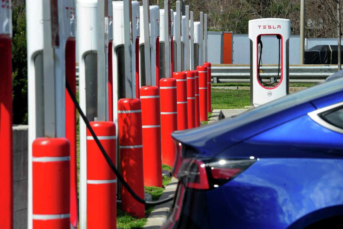 A row of Tesla charging stations are available at the northbound rest stop off Interstate-95 in Fairfield.