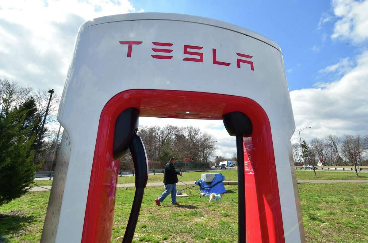 A row of Tesla charging stations are available at the northbound rest stop off Interstate-95 in Fairfield.