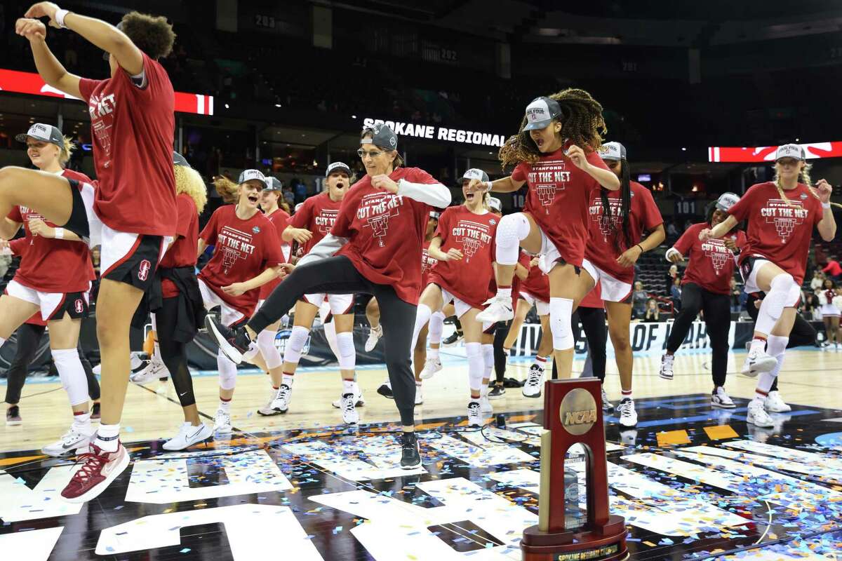 SPOKANE, WASHINGTON - MARCH 27: The Stanford Cardinal team dances on the court after defeating the Texas Longhorns 59-50 in the NCAA Women's Basketball Tournament Elite 8 Round at Spokane Veterans Memorial Arena on March 27, 2022 in Spokane, Washington. Stanford defeated Texas 59-50 (Photo by Abbie Parr/Getty Images)