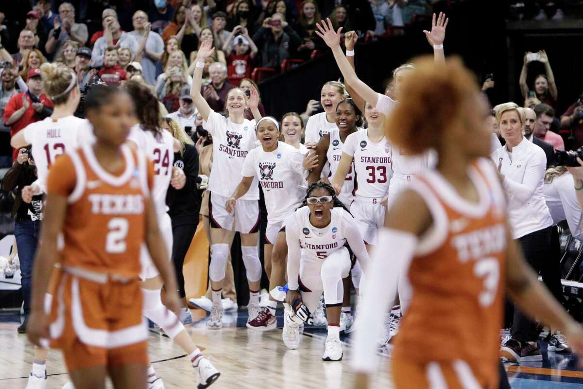 Stanford players react from the bench at the end of a college basketball game against Texas in the Elite 8 round of the NCAA tournament, Sunday, March 27, 2022, in Spokane, Wash. Stanford won 59-50. (AP Photo/Young Kwak)