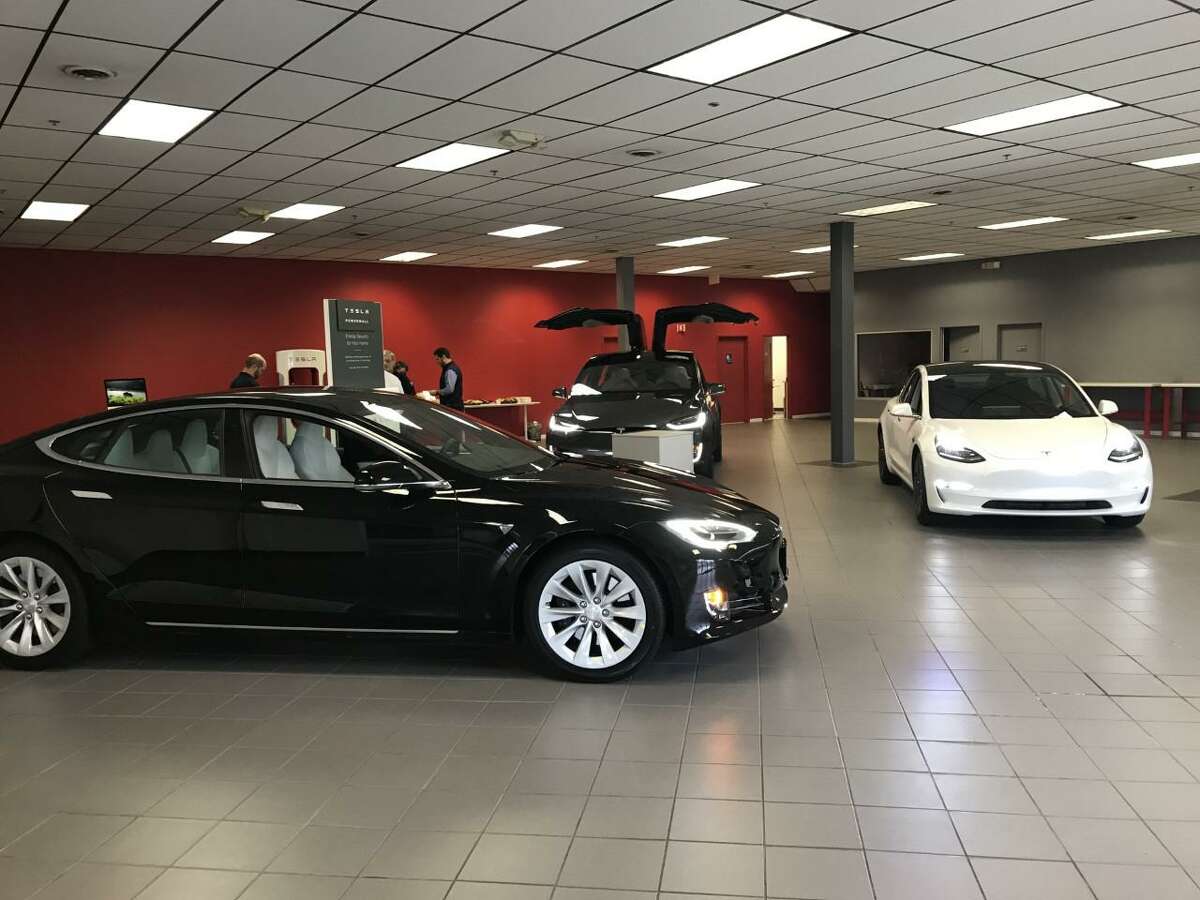 FILE PHOTO: Three of the Tesla models at the company's service facility in Milford. A bill allowing electric vehicle manufacturers to sell directly to customers in Connecticut has passed its first hurdle, but faces intense opposition from the state’s car dealers.