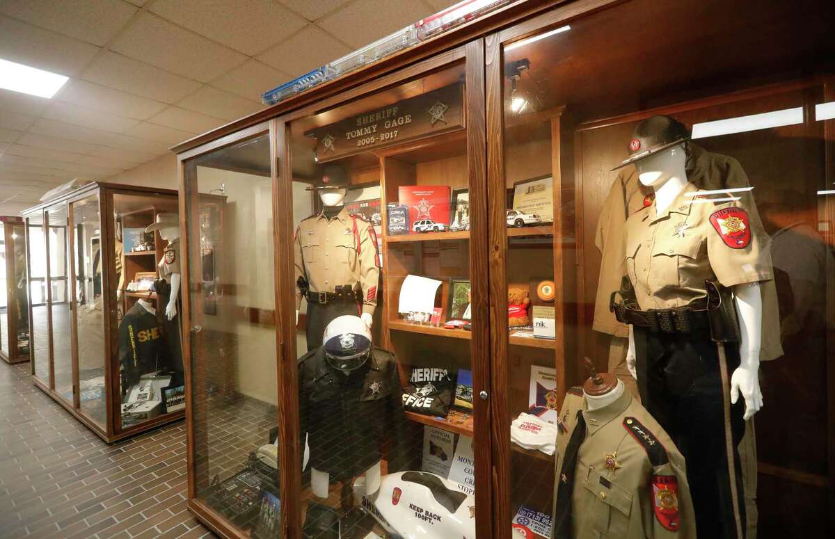 Various items from the history of the Montgomery County Sheriff’s Office are seen in a hallway at the Montgomery County Jail complex, Wednesday, March 2, 2022, in Conroe. The department is working to put together displays that show the more than 100 year history of the department.