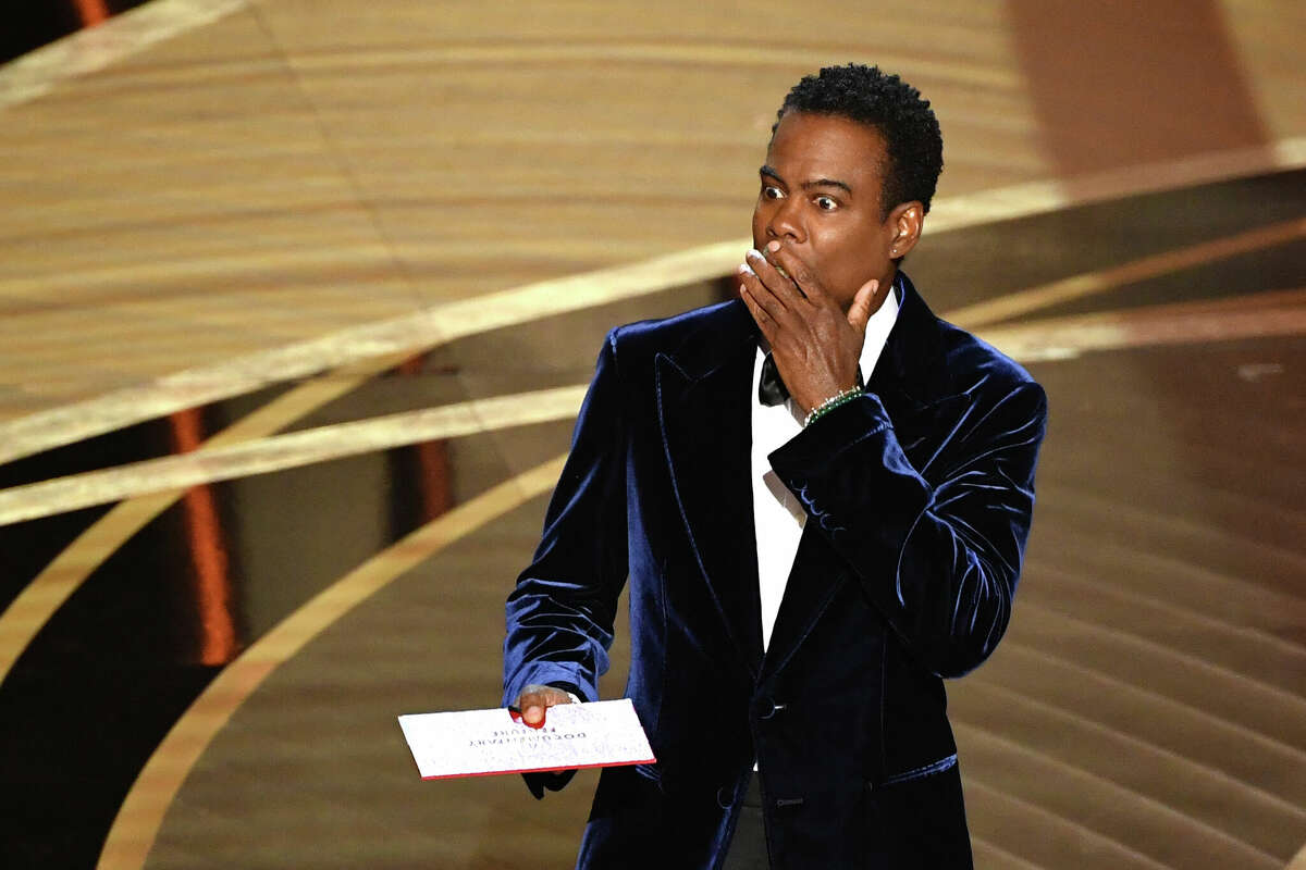 US actor Chris Rock speaks onstage during the 94th Oscars at the Dolby Theatre in Hollywood, California on March 27, 2022. (Photo by Robyn Beck / AFP) (Photo by ROBYN BECK/AFP via Getty Images)