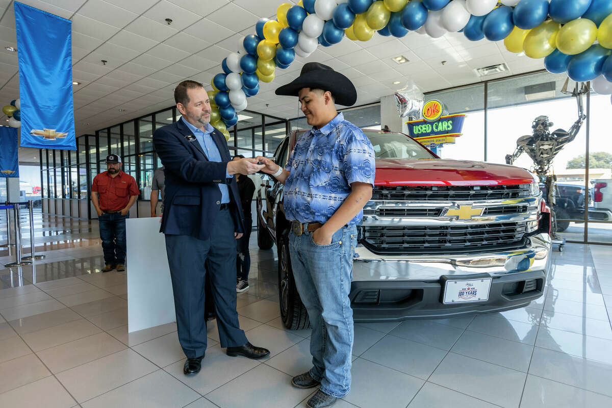 Riley Leon, a 16-year-old who survived a recent Texas tornado while driving a red Chevrolet Silverado truck receives the keys to his new 2022 Chevrolet Silverado 1500 LT All-Star Edition pickup from Chevrolet South Central Regional Director Don Wagner, Saturday, March 26, 2022 at Bruce Lowrie Chevrolet in Ft. Worth, Texas. The truck was donated by Chevrolet and Bruce Lowrie Chevrolet. (Photo by Brandon Wade for Chevrolet)