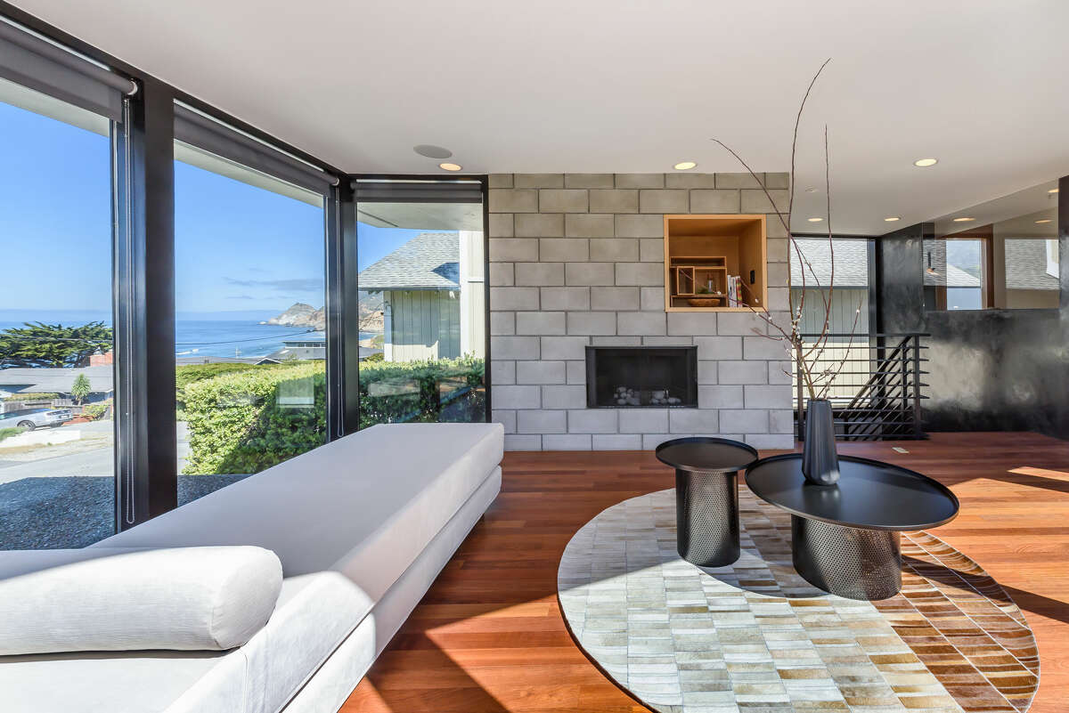 The sea is a nearby neighbor, but the coastal chill is offset by three fireplaces inside the home. 