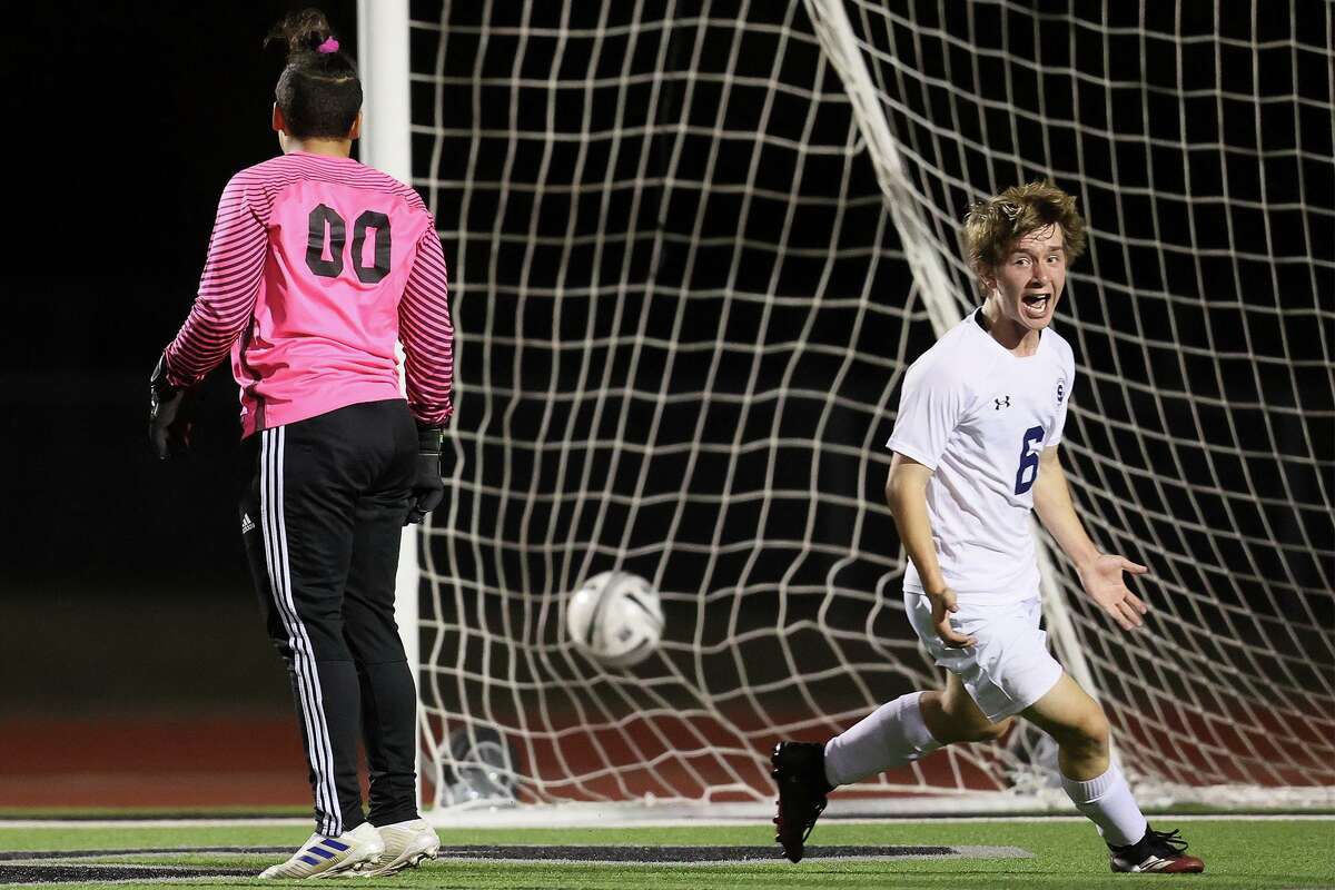 Smithson Valley’s Xavier Spotanski celebrates his game winning goal past Steele goalkeeper Antwan Amarius with 1:42 remaining in their District 27-6A boys soccer game at Steele on Tuesday, Feb. 23, 2021. Smithson Valley beat Steele 2-1.
