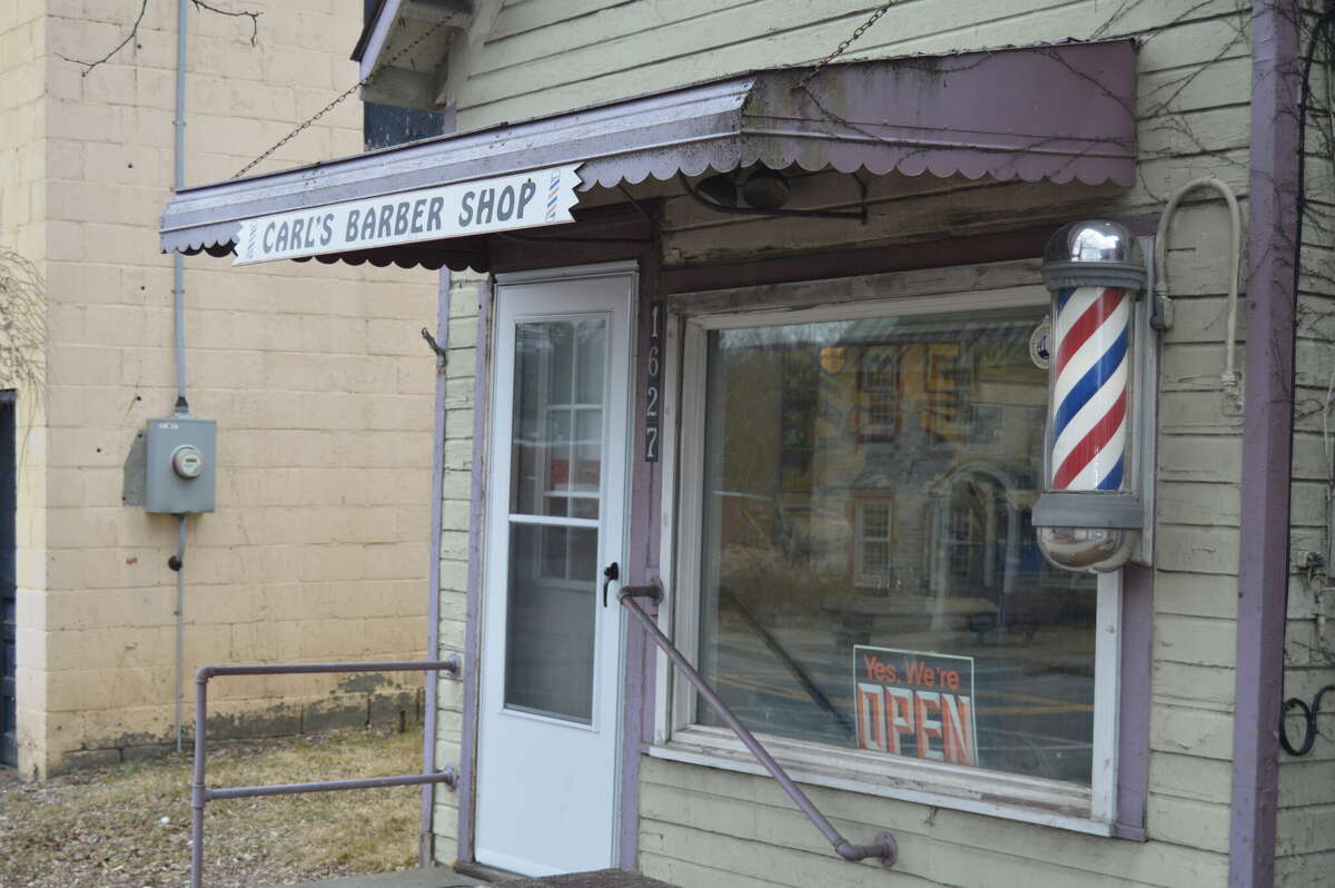 No fade here Barber marks half a century of haircuts