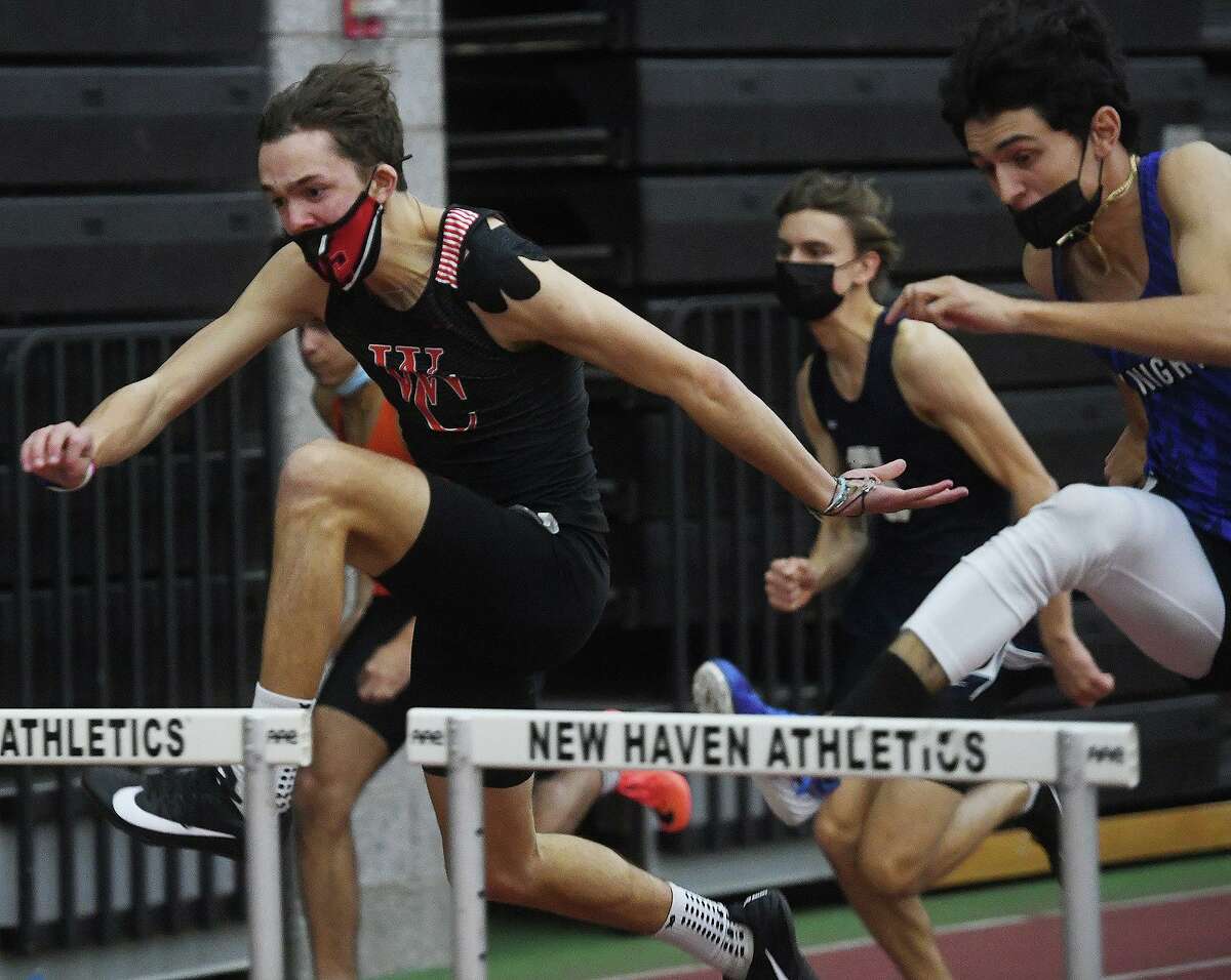 Wilbur Cross' Blake Battaglia races to victory in the 55 meter hurdles at the Class LL Track Championships at the Floyd Little Athletic Center in New Haven, Conn. on Friday, February 11, 2022.
