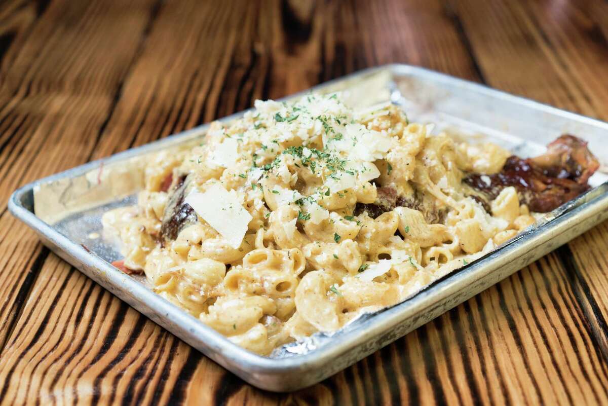 Turkey Leg Hut's signature slow-smoked turkey thigh options included topped with Cajun crawfish macaroni and cheese.