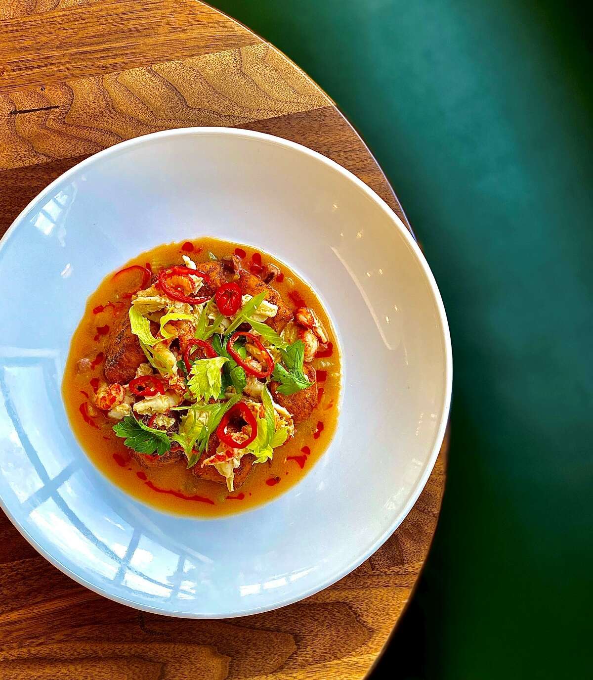 Knowledge in the Heights offers blackened gnocchi with crayfish sauce and etouffee sausages.