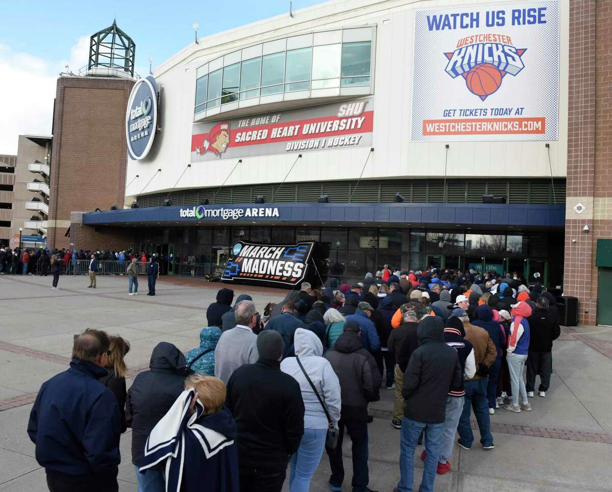 Hundreds of fans wait for the gates to open Monday for the NCAA women’s basketball tournament Elite Eight matchup between No. 2 UConn and No. 1 North Carolina State at Total Mortgage Arena in Bridgeport.