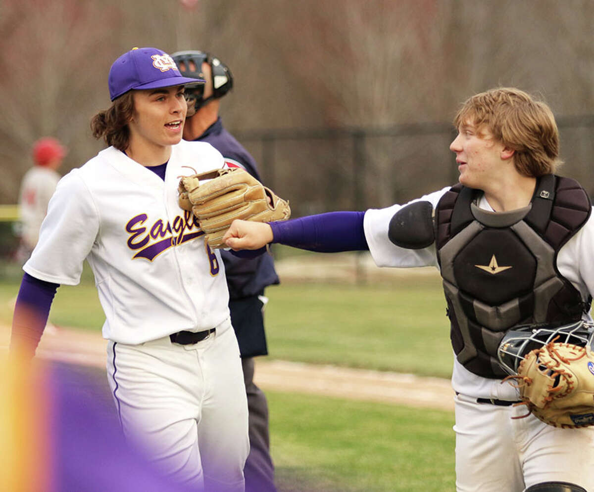 CM pitcher Nick Williams (left) is congratulated by catcher Noah Petersen after throwing a no-hitter against Alton on Monday at the Bethalto Sports Complex.