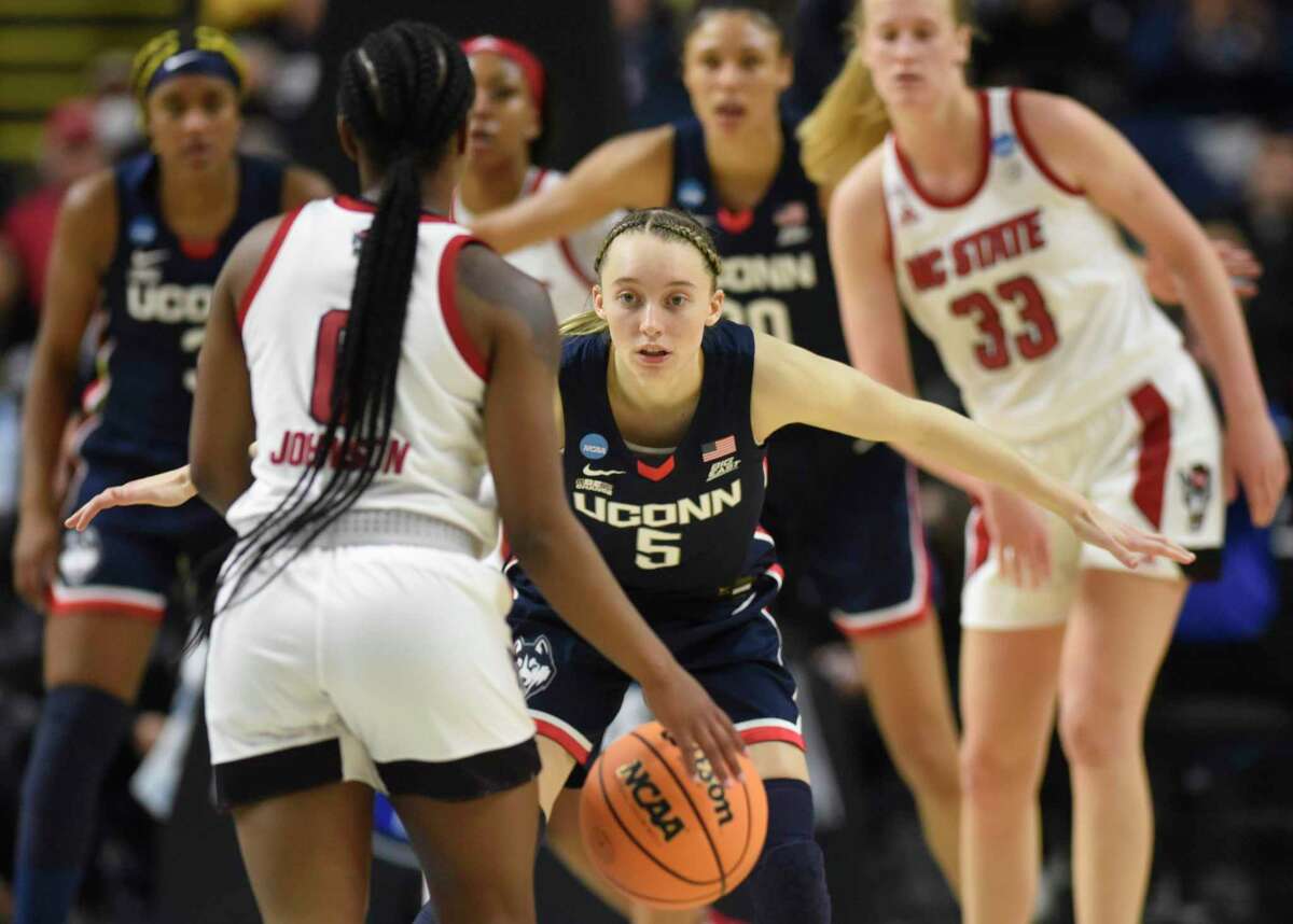 UConn's guard Paige Bueckers (5) plays defense in No. 2 UConn's 91-87 double overtime win against No. 1 NC State in the NCAA women's basketball tournament Elite Eight matchup at Total Mortgage Arena in Bridgeport, Conn. Monday, March 28, 2022.