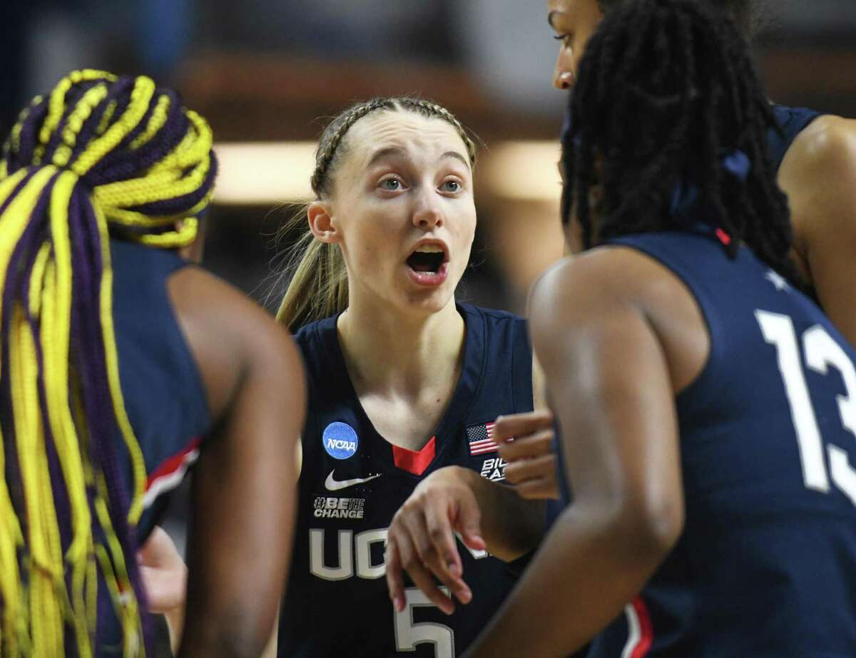 UConn’s Paige Bueckers (5) rallies her teammates in the NCAA women’s basketball tournament Elite Eight matchup between No. 2 UConn and No. 1 NC State at Total Mortgage Arena in Bridgeport, Conn. Monday, March 28, 2022.
