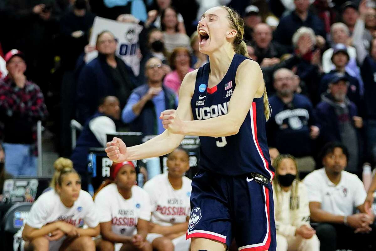 Connecticut guard Paige Bueckers (5) reacts in double overtime against NC State during the East Regional final college basketball game of the NCAA women's tournament, Monday, March 28, 2022, in Bridgeport, Conn. (AP Photo/Frank Franklin II)