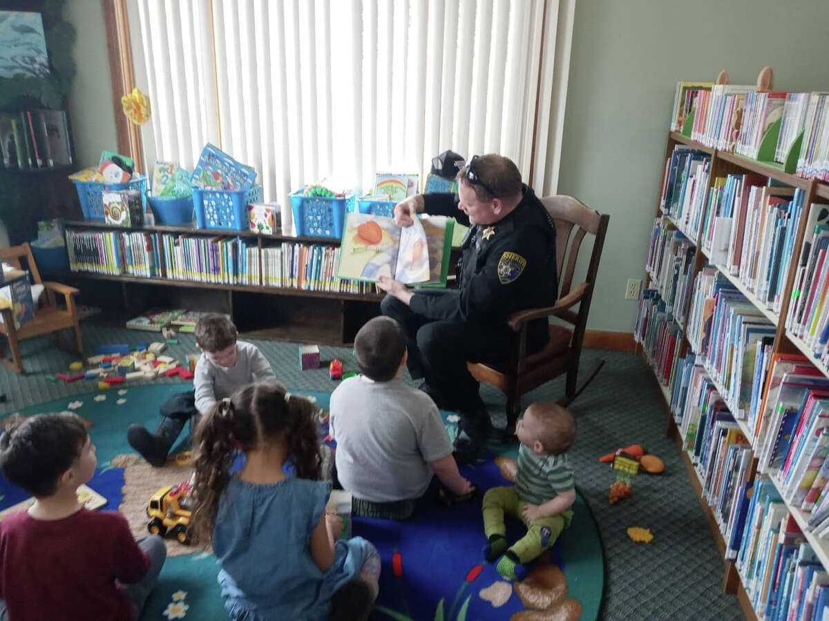 Sheriff Rich Martin shared with the children at Luther Area Public Library by reading a book during Story Hour. 