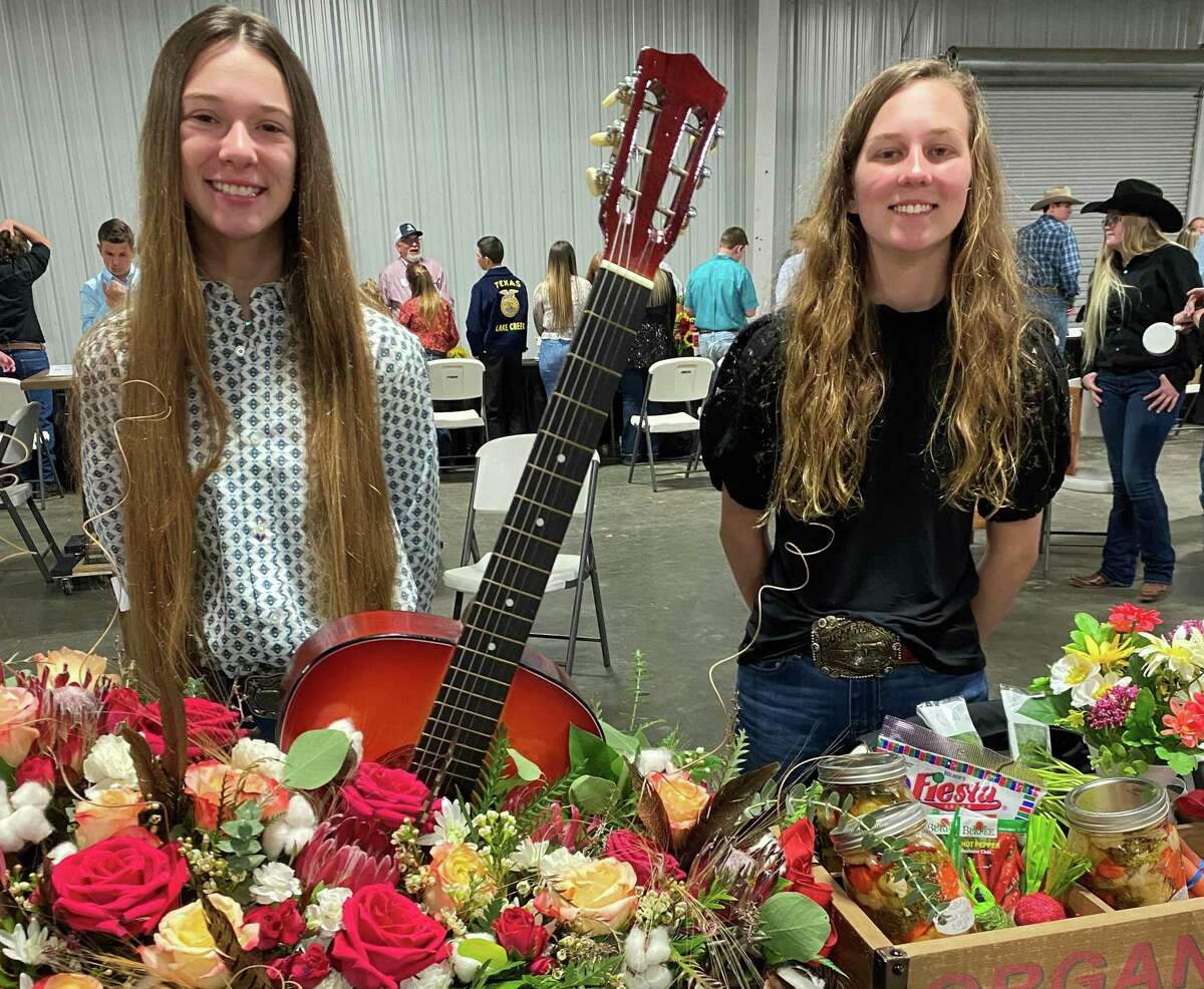 Handicrafts and baked goods took the center stage at Monday night's Junior Non-livestock Auction at the Montgomery County Fair. Seventy five participants that placed first through fifth place auctioned off their handicraft or baked good. Pictured are Kendall Bomer, left with her Grand Champion Horticulture entry and Mallory Majors, right, with her Grand Champion Canned Good entry.