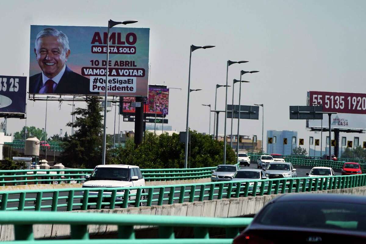 A billboard featuring Mexico's President Andres Manuel Lopez Obrador. He has involved himself in the strategic decisions of Pemex to a much greater degree than any prior president, the author writes.