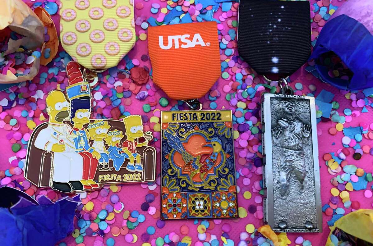 2022 Express-News Fiesta Medals Contest winners, from left: 1st place: Doh! by Glenn Goolsby, $12 at saflavormedals.com; 2nd place: UTSA Fiesta 2022, available as giveaway to UTSA students and staff; 3rd place: Carbonite Fiesta Medal by Garrett Heath, $12 at saflavormedals.com