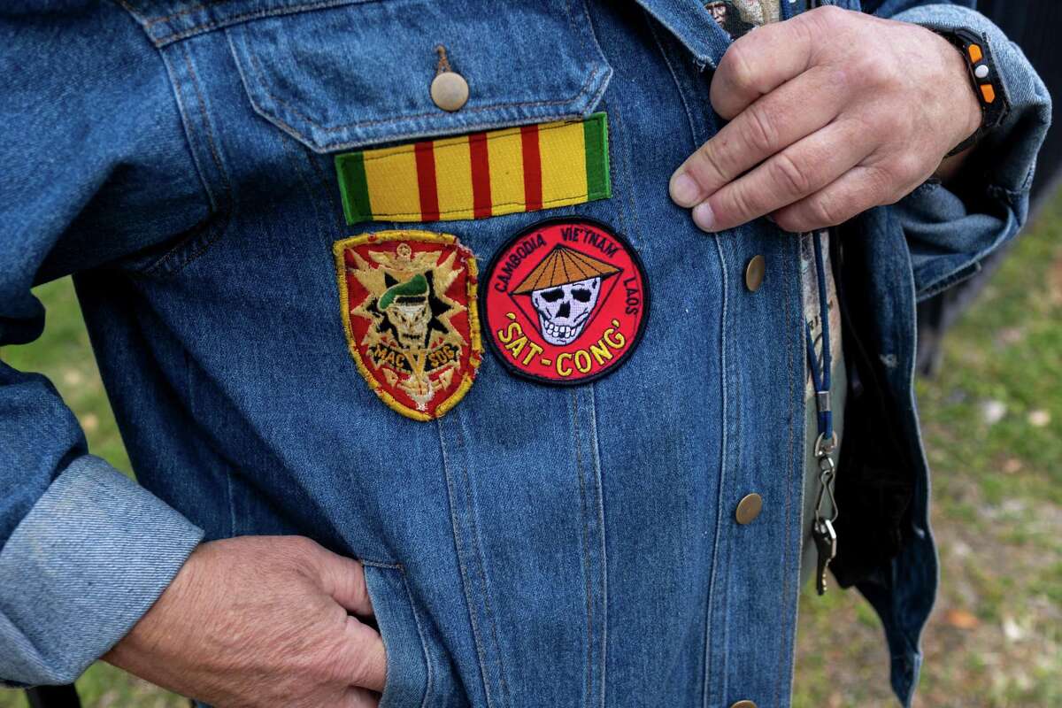 Vietnam veteran Robert “Spirit” Dembinsky shows off the patches on his jacket during a breakfast Tuesday at Haven for Hope to mark National Vietnam War Veterans Day.