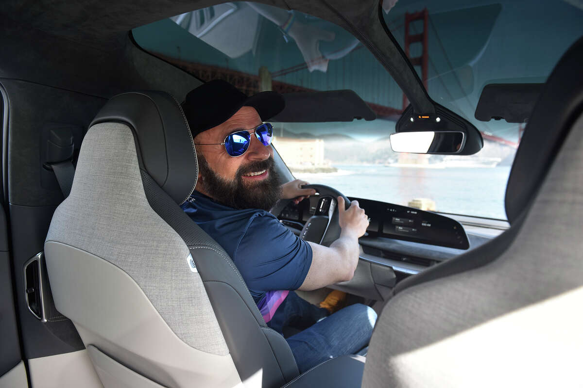 Turo CEO Andre Haddad pictured in his Lucid Air electric vehicle, near Fort Point in San Francisco, on Friday, March 18.