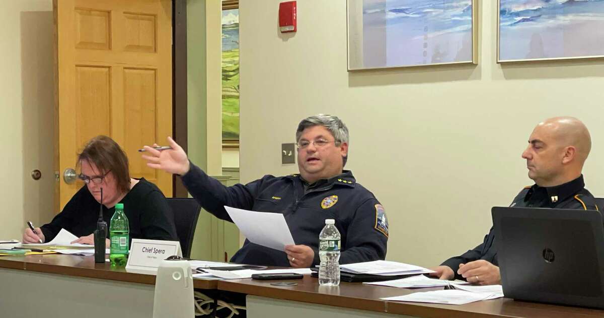 Old Saybrook Chief of Police Michael Spera, center, addresses the police commission on March 29, 2022. He is pictured with Commissioner Renee Shippee, left, and Capt. Jeffrey DePerry, right.