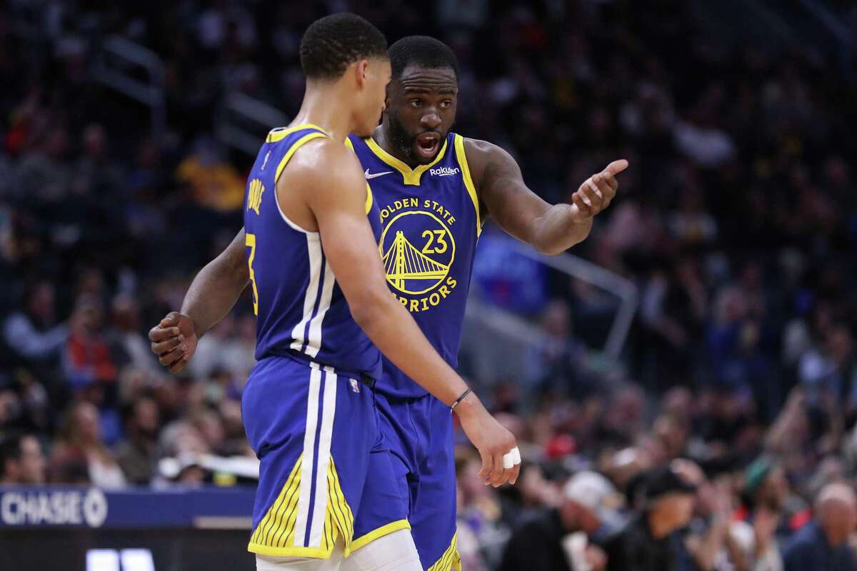 Golden State Warriors' Draymond Green schools Jordan Poole during Warriors' 126-112 win over Washington Wizards in NBA game at Chase Center in San Francisco, Calif., on Monday, March 14, 2022.
