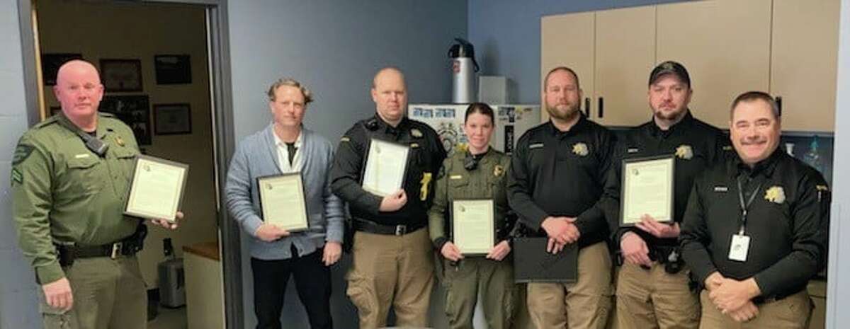 (From left) Conservation officers Justin Vanderlind, Sgt. Troy Packard, deputy Joe Send, conservation officer  Amanda Weaver, deputy Ryan Dumond and deputy Mitchell Smith were honored with the Professional Excellence Award by Sheriff Kyle Rosa for their collective efforts to apprehend a person.   