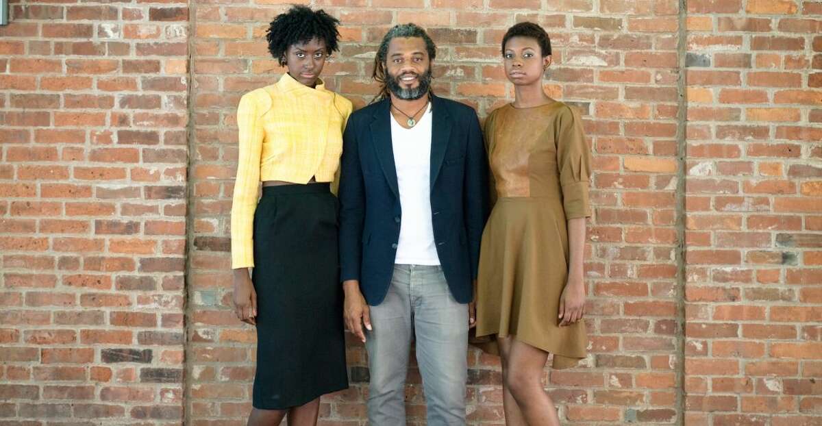 Neville Wisdom and models wearing his designs, in a photo from his Facebook page. (All photos are courtesy of the designer.)