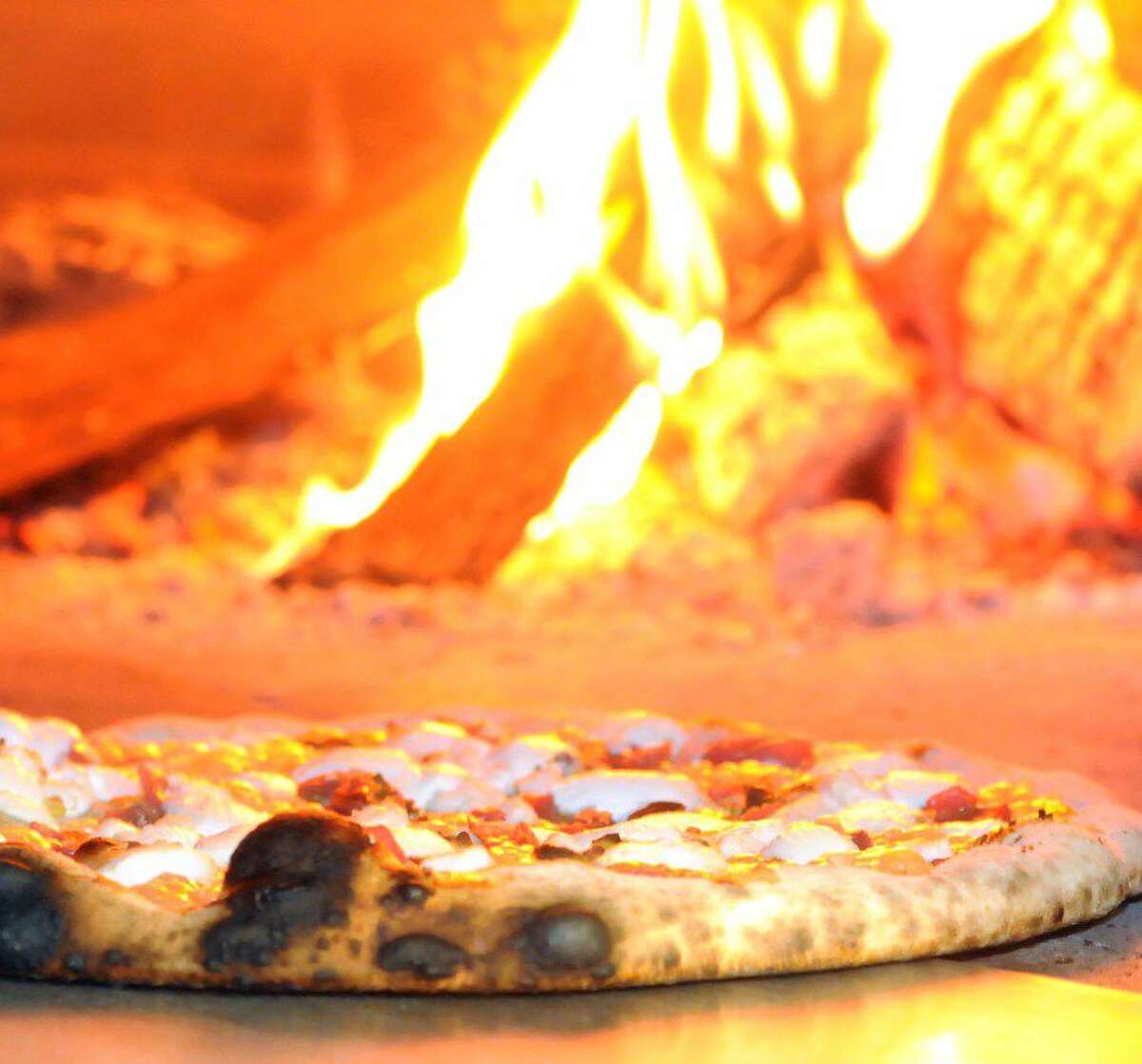 Pizzas take 90 seconds to cook in Da Legna’s wood-fired oven.