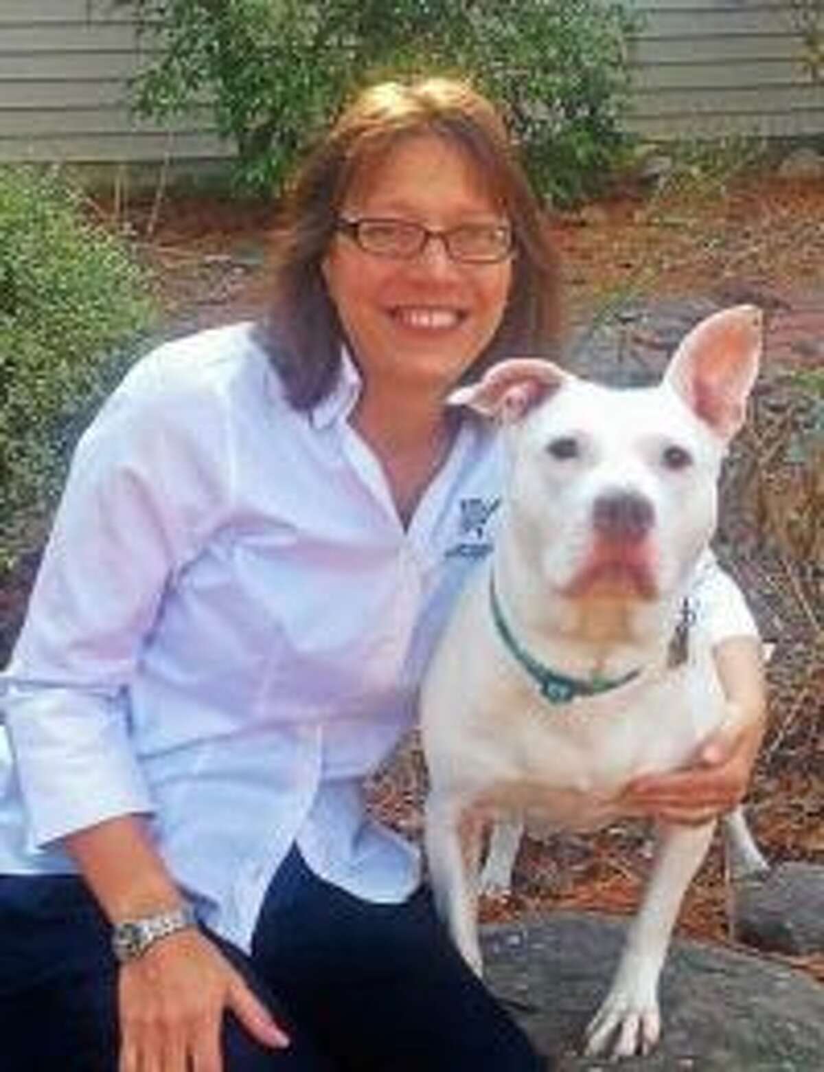 Annie Hornish, the American Humane Society's state director for Connecticut, pictured with her shelter-adopted dog Tofu. Hornish said the new laws are working but added that some pet shops are still dealing with alleged puppy mills.