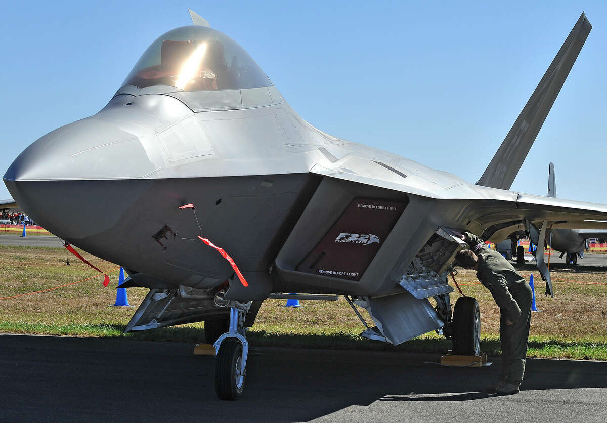 U.S. Air Force Lt Col Jeff Hawkins of the 94th Fighter Squadron inspects a F-22 Raptor during the Australian International Airshow in Melbourne on March 1, 2013. Separate attempts to leak Connecticut-based company documents related to the F-22 to Iran and China have allegedly taken place over the past year.