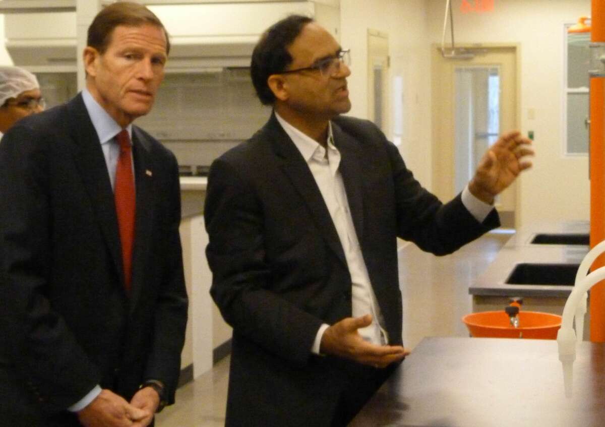 Dr. Anil Diwan shows Senator Richard Blumenthal the NanoViricides Shelton lab on Monday.