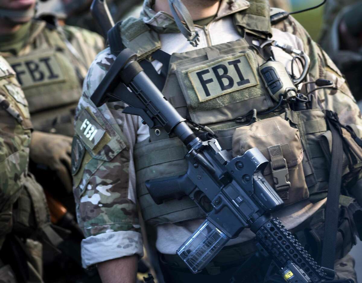 Members of a Federal Bureau of Investigation SWAT team are seen during an FBI field training exercise at the Landmark Mall May 2, 2014, in Alexandria, Va.